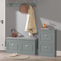 a coat rack and bench in a room with grey walls, wooden flooring and white doors