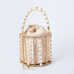 SPECIFICATIONSStyle: FashionShape: BucketPlace Of Origin: GUANG DONG ProvincePattern Type: Hollow OutOrigin: CN(Origin)Occasion: PartyModel Number: AK-1912202Main Material: MetallicLining Material: PolyesterInterior: Cell Phone PocketHardness: HARDGender: WOMENDecoration: DiamondsDecoration: BeadingDecoration: Hollow OutDecoration: ChainsDecoration: PearlClosure Type: STRINGBrand Name: AlizekerrMaterial: Metal Craft :Handmade Size:  Length 5.31in/13.5cm  Width 5.31in/13.5cm  Height 4.72in/12cm N Cage Bag, Metallic Clutch Bag, Pearl Clutch Bag, Bridal Clutches, Metallic Handbags, Pearl Clutch, Bridal Handbags, Designer Clutch Bags, Metallic Clutch