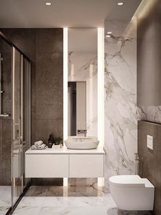 a modern bathroom with marble walls and flooring