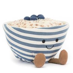 a blue and white striped bowl with a smiling face