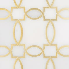 a white wall with gold circles and square shapes on the bottom, in front of a white background