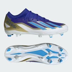 a soccer shoe with blue and gold detailing on the bottom, next to it's sole