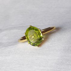 The Buyer Must Be Reads All Details About The Product . Material  14k Yellow Gold  . Gemstone  Natural Peridot  . Gemstone Colour .... Green . Gemstone Size  6x8 mm . Gemstone Shape  Oval . Birthstone  August Birthstone Peridot Band Ring, Classic Oval Gemstones For Wedding, Classic Peridot Gemstone Diamond Ring, Green Oval Cabochon Emerald Ring For Wedding, Green Emerald Oval Cabochon Ring For Wedding, Oval Peridot Diamond Ring For Formal Occasions, Classic Peridot Diamond Ring, Formal Oval Peridot Diamond Ring, Formal Peridot Ring With Accent Stones