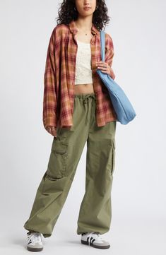 Perfect your '90s grunge aesthetic with an oversized, layer-ready button-up shirt made from lightweight plaid flannel. Front button closure Spread collar Long sleeves with button cuffs 55% cotton, 45% rayon Machine wash, tumble dry Imported Not available for sale and shipment to Germany Flannel Shirt With Cargo Pants, Spring Casual Cotton Flannel Shirt, Casual Relaxed Fit Flannel Shirt For Spring, Summer Casual Button-up Flannel Shirt, Casual Plaid Cotton Flannel Shirt, Casual Summer Button-up Flannel Shirt, Relaxed Fit Flannel Shirt For Fall Streetwear, Oversized Flannel Shirt For Everyday, Casual Flannel Shirt For Streetwear