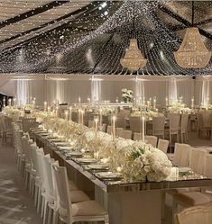 an elegant banquet hall with chandeliers and tables set up for a formal function