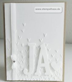 a white card with the word jal on it and hearts in the shape of letters