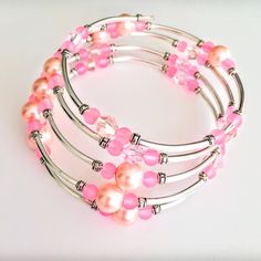 This Brand New Handcrafted Memory Wire Bracelet Has A Silver Plated Memory Wire And Pink Crystal Beads, Pink Frosted Glass Beads, Pink Glass Pearl Beads, Silver Plated Tube Beads And Silver Spacer Beads. Inside Diameter 2 1/4 Inches Will Fit Small Adult Or Teen Wrists Or Can Be Wrapped Around Wrists That Measure Approx Up To 6 1/2 To 7 Inches Pink Wire Wrapped Beaded Bracelets With Round Beads, Beaded Memory Wire Bracelets, Beaded Memory Wire, Memory Wire Bracelet, Memory Wire Bracelets, Wire Bracelet, Memory Wire, Tube Beads, Pink Glass