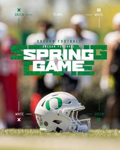 a football helmet sitting on top of a field with the words spring game written across it