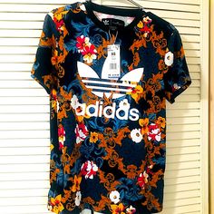 New With Tags Adidas Originals Floral Trefoil Very Oversized Rare Graphic Tee Shirt Size Xs But Will Easy Fit Up To A Large. Trendy Blue Floral Print T-shirt, Adidas Summer T-shirt With Graphic Print, Adidas Graphic Print T-shirt For Summer, Adidas Multicolor Graphic Print Tops, Adidas Multicolor Graphic Print T-shirt, Adidas Multicolor Short Sleeve Tops, Adidas Multicolor Crew Neck T-shirt, Sporty Multicolor Adidas Tops, Adidas Sporty Multicolor Tops