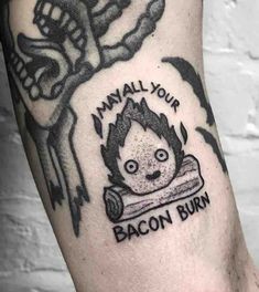 a man with a tattoo on his arm that says, manual your bacon burn