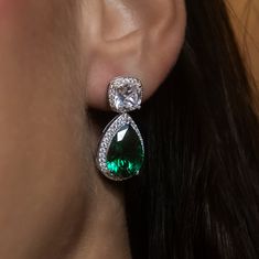 Introducing the Iced Emerald Cushion Cut Drop Earrings in 14k White Gold. This stunning pair of drop earrings features a cushion cut diamond stud and an emerald teardrop stone with a pave border, complete with 14k Solid Gold posts. Dress up your fit and add a touch of color to your look with this GLD exclusive; it's sure to shine! This product is guaranteed for life – GLD will repair or replace the item should you experience any defects in craftsmanship or breakage. *Earrings sold in pairs* *14k Cushion Cut Diamond, Cushion Cut Diamonds, Vermeil Jewelry, Custom Earrings, Diamond Stud, Single Earring, Pendant Bracelet, Drop Necklace, Cushion Cut