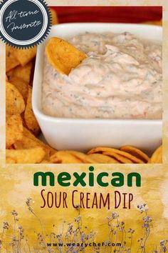 the mexican sour cream dip is served in a white bowl with tortilla chips