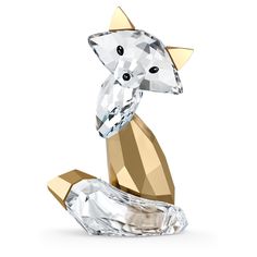 an animal figurine made out of glass and gold foil with a diamond on top