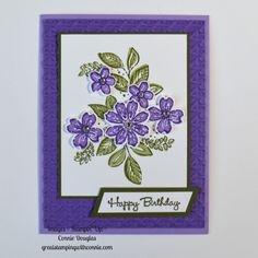 a birthday card with purple flowers on it