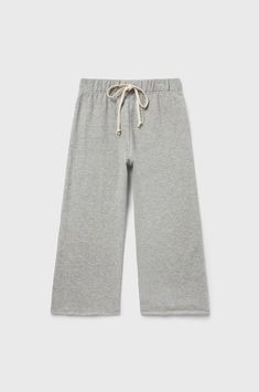 The French Flare Pant you know & love is now here for the little ones! The wide leg silhouette gives a perfectly polished look without sacrificing comfort, making them easy to dress up or dress down. Adorned with a soft elastic waistband and a natural Cotton drawcord, ensuring that perfect fit. The best part? These 100% Cotton pants are pre-laundered for that extra touch of coziness and are fully machine washable for hassle-free care. Pair back to the Varsity Crewneck or Boxy Tee for a cute look Varsity Crewneck, Flare Sweatpants, Flare Pant, Jersey Pants, Boxy Tee, Grey Sweatpants, Loungewear Set, Cotton Pants, Grey Cotton