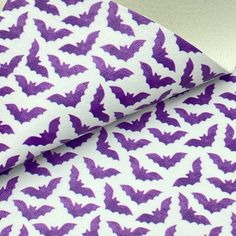 purple bat print on white fabric