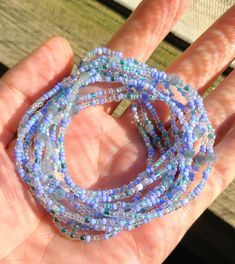 This listing is for a set of ten seed bead boho beaded bracelets. These baby blue multi color confetti bracelets have dainty, tiny beads and chunky round beads are strung on strong elastic. They are double knotted and glued shut. These stretchy, stackable bracelets would be cute friendship bracelets or gifts for best friends, gifts for her. Blue Spacer Beads Bracelets For Festivals, Blue Festival Bracelets With Spacer Beads, Trendy Flexible Jewelry With Colorful Beads, Festival Stretch Bracelet With Colorful Beads In Blue, Blue Stretch Bracelet With Colorful Beads For Festival, Handmade Blue Stretch Bracelet For Festivals, Summer Hand-strung Beaded Bracelets, Bohemian Flexible Jewelry With Round Beads, Blue Bohemian Heishi Beads Jewelry