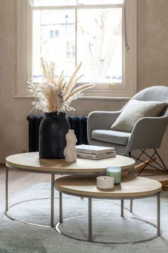 a living room with two chairs and a coffee table