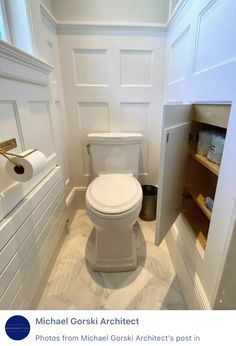 a white toilet sitting inside of a bathroom