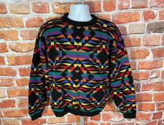 "incredibly bright vintage women's sweater with rainbow Aztec designs. Lightly used no major issues beyond tag has been removed MEASURES -  23\" pit to pit and 26\" long TAGGED - removed fits L ~ BE SURE TO CHECK OUT MY ENTIRE SHOP ~ - This is a TRUE VINTAGE item! Vintage clothing sizing varies wildly ALWAYS use the measurements and info provided in the listing to assure proper fit! Unless the words \"deadstock\" or \"unworn\" are used please understand this is a USED item. RETURNS - My policy is NO RETURNS but I will make an exception if you agree to cover the return shipping as well as forfeit the shipping I paid to ship the item. If I made an error I will make it right 100% but I am not responsible if you change your mind/\"item does not fit\". Please use the measurements provided if yo Rainbow Crew Neck Top For Winter, Multicolor Graphic Print Sweater For Winter, Winter Multicolor Graphic Print Sweater, Retro Multicolor Sweater For Streetwear, Multicolor Crew Neck Sweater For Streetwear, Fitted Multicolor Crew Neck Sweater, Vintage Multicolor Sweater With Graphic Print, Multicolor Vintage Sweater With Graphic Print, Multicolor 90s Sweater For Winter