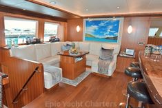 a living room filled with furniture on top of a wooden floor