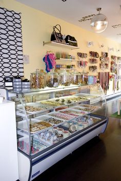 a display case in a store filled with lots of food and confection items