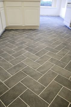 an image of a kitchen floor that looks like tile