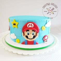 there is a cake that looks like mario's house on the top of it