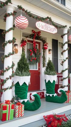 christmas decorations on the front porch of a house