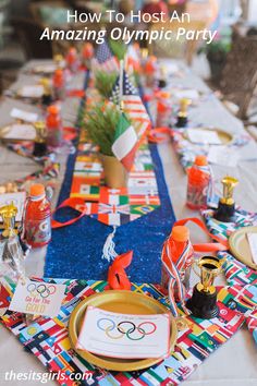 the olympic party table is set up with colorful napkins and place settings