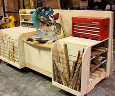 a work bench made out of wood with tools on it in a garage area next to other items