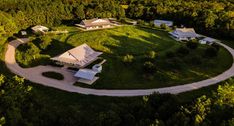 an aerial view of a home surrounded by trees