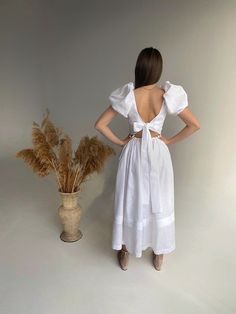 This pinafore linen dress features bow on the back with puffy sleeves. Mid-calf length. Boho linen dress  is just perfect for wedding, birthday outfit and for photoshoot. The model is 168 cm/ 66,15 inches height and is wearing size S.  Our sizing based full height (from the head top to heels). Please check the size chart before you place your order. The size chart is the picture of the listing. ✅ Materials:  linen (flax) - Oeko-tex 100 certified. ✅ Processing time: 1-3 business days. ✅ Recommend Short Sleeve Dress With Bow Tie Back For Brunch, Linen Dress With Tie Back And Square Neck, White Puff Sleeve Dress With Tie Back For Brunch, White Puff Sleeve Dress With Tie Back, Puff Sleeve Midi Dress With Tie Back For Brunch, Tie-back Midi Dress With Puff Sleeves, Puff Sleeve Dress With Tie Back For Brunch, Puff Sleeve Dresses With Tie Back For Brunch, Elegant Fitted Linen Dress With Smocked Back