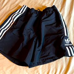 Nwot Adidas Shorts - Mesh Pockets Embroiders Logo On Side. Not Cotton Or Mesh Shorts (Note Of A Windbreaker Material ) Bought And Never Worn Casual Or Athletic Adidas Athletic Shorts For Streetwear, Adidas Three Stripes Shorts For Summer, Adidas Three Stripes Summer Shorts, Summer Streetwear Shorts With Three Stripes Branding, Summer Athleisure Shorts With Three Stripes Branding, Short Bottoms With Three Stripes Branding For Summer, Adidas Bottoms For Streetwear, Adidas Bottoms For Summer Streetwear, Summer Athletic Shorts With Three Stripes Branding