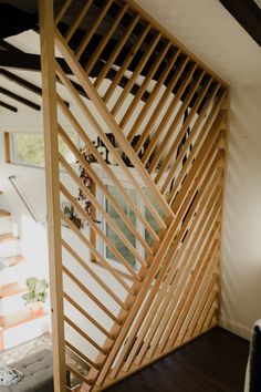 a room divider made out of wooden slats