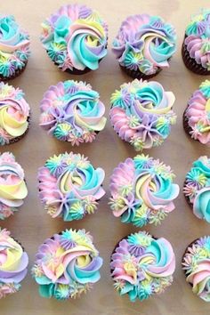 cupcakes decorated in pastel colors and swirls