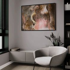 a painting hanging on the wall in a living room