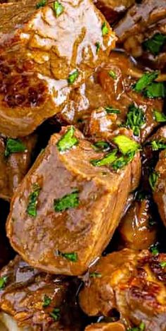 beef and mushrooms with gravy in a bowl