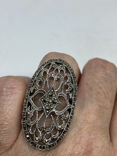 Vintage ring surrounded by Swiss cut fine Marcasite Sterling silver Size 6.25 can be sized by my jeweler. His service charge is $10-$20 All rings are shipped free in the US in a nice gift box. Check out our over a THOUSAND great reviews Engraving is $4 per letter and is not always perfect depending on the piece. It can take a few days if the jeweler is busy. This is payable to Paypal Judithsltd@gmail.com Art Deco Silver Filigree Ring As Gift, Silver Art Deco Filigree Ring As Gift, Silver Filigree Ring, Art Deco Style, Gift, Silver Art Deco Filigree Ring Gift, Silver Art Deco Ring Gift, Silver Anniversary Ring, Gothic Ring, Gothic Rings, Vintage Gothic