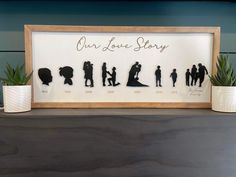 the silhouettes of people are on display in front of a sign that says our love story