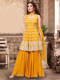 You look wonderful in this yellow punjabi palazzo set at festivals. Detailing with all over thread and sequins details. Furthermore design with round neck and sleeveless. Includes matching palazzo bottom and dupatta. Weight1.50 Kg Dispatch2 Day* OccasionFestival, Partywear WorkSequins, Thread StylePunjabi NeckRound Neck SleeveSleeveless PatternPalazzo Sarara Dress, Mayon Dresses, Salwar Design, Georgette Suits, Kameez Design, Palazzo Dress, Georgette Sharara, Embroidered Suits, Haldi Dress