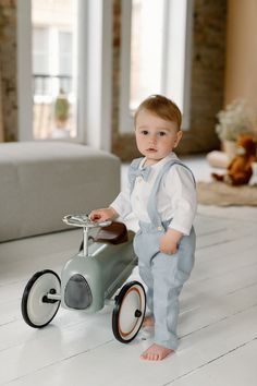 This is a super cute boy baptism suit, that contains light blue colour linen pants, white linen shirt with 3/4 folded sleeves and matching bow tie. It will be ideal for sunny days as linen shirt provides coolness in hot weather, it will dry easily and are breathable. Since linen is absolutely natural fabric, you can be sure it is the perfect choice for your little one.  This outfit is perfect if you are looking for a super comfortable and cute boy summer clothes, boy linen clothes, a page boy ou Christening Clothes For Baby Boy, Boys Christening Ideas, Baby Suits Boy, Bautizo Ideas Boy Outfits, 1st Birthday Boy Outfit Ideas, Baptism Boy Outfit, Baptism Outfits For Boys, Baby Boy 1st Birthday Outfit, First Birthday Boy Outfit