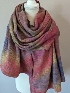 Earth tone colors blend and layer to create the perfect cool weather accessory. Wrap up in this gorgeous, hand dyed hand woven shawl. Silky soft, US grown and milled Supima cotton warp features hand dyed swaths of loamy brown, clay, terracotta, gold, leaf green, and navy. Hand dyed kapok modal weft in light copper brown interweaves in a large scale, textured crackle weave pattern. Kapok is a natural fiber that is wonderfully insulating, making this shawl a cozy choice for cool weather outer wear. Measures a generous 32" wide by 82" long. Dress up an evening ensemble with this handwoven shawl, or wear as a blanket scarf to feel fabulous by day.  50% Cotton 25% Kapok 25% Modal Wash separately in cool water with mild detergent by hand. No bleach. Flat dry. Cool iron as needed. Please check my Bright Scarf, Handwoven Shawls, Custom Strap, Handwoven Scarf, Woven Scarves, Earth Tone Colors, Gray Silk, Blanket Scarf, Supima Cotton