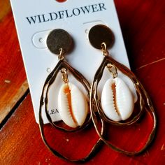 Goldtone Cowrie Shell Pierced Earrings Bohemian Gold Flower Earrings For Beach, Gold Dangle Teardrop Earrings For Beach, Gold Cream, Cowrie Shell, Cream And Gold, Pierced Earrings, Earrings Color, Earings Piercings, Gold Tones