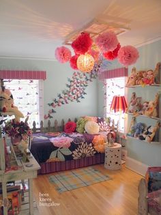 a room with many stuffed animals on the wall