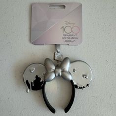 a pair of mickey mouse ears with a tag attached to it