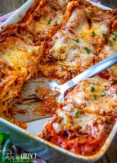 lasagna casserole in a white dish with a fork