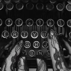 hands typing on an old fashioned typewriter