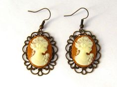 "Victorian Jewelry Gift for Mom Wife, 8th Anniversary Earrings Bronze Jewelry Gifts, Peach Victorian woman cameo earrings featuring your choice of cameo designs and colors encased in fancy scalloped antiqued bronze settings. Great gift for your best friend, sister, Mom. Great 8th or 19 Anniversary gift for your wife (bronze anniversary) or give to show your appreciation for your best friend, sister, Mom. Metal - antiqued bronze Length: 2 inches Arrives with a Marty White card in a lovely decorat Classic Cameo Earrings, Classic Cameo Earrings Gift, Cameo Drop Earrings Jewelry Gift, Cameo Drop Earrings As Gift, Cameo Earrings For Gift, Gift Cameo Drop Earrings Jewelry, Cameo Drop Earrings For Gifts, Cameo Round Earrings As Gift, Gold Cameo Earrings As A Gift