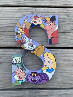 the letter s is painted with cartoon characters